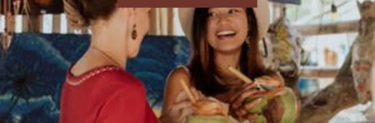 Colombian women smiling at each other